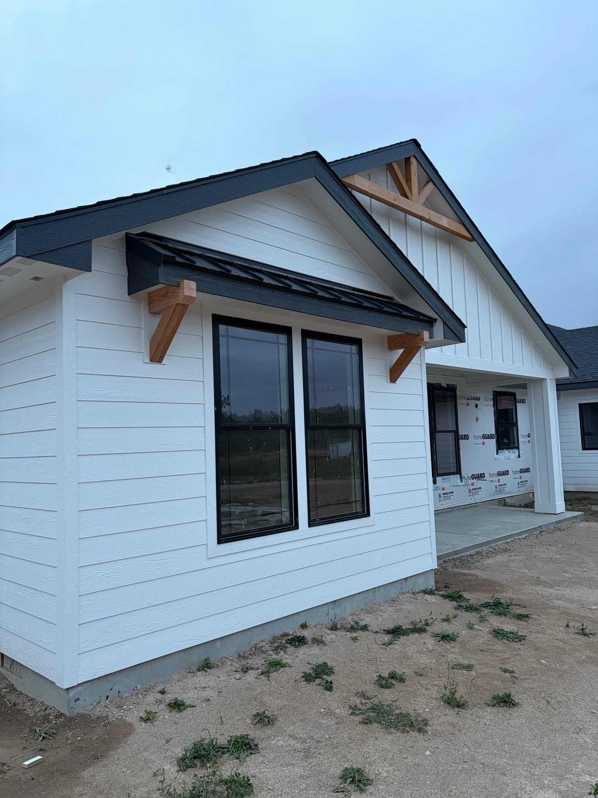 Gallery photos for New Construction Roofing and Siding with High-Wind Shingles and Custom Accents: Image #1